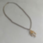Necklace with gold-toned chandelier charm