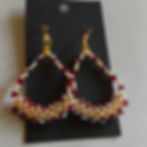 Beadwoven hanging earrings with crystals and seed beads.