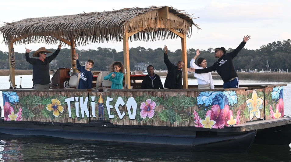 People enjoying a day on the tiki boat