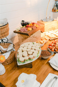 food table with tea sandwiches and other appetizers