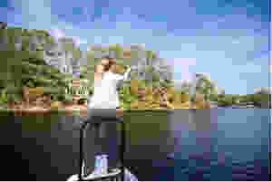 fisherman casting in palmetto dunes lagoon