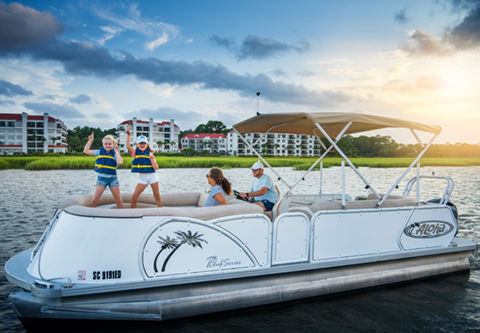 Family enjoying pontoon boat rental in water