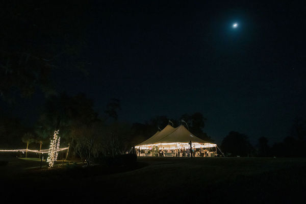 view of the event tent lit up at night