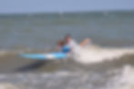 boy learning how to surf