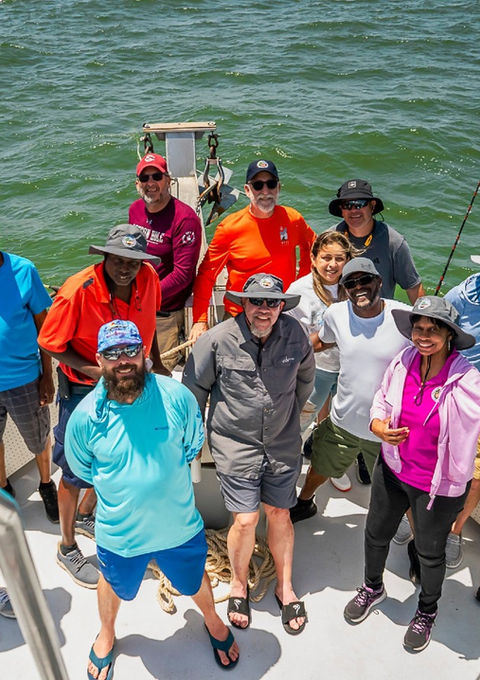 Group of anglers on the bow of Captain Hook