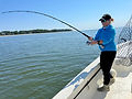 Woman fishing on the water