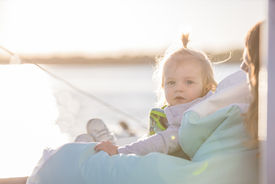 Little girl sitting in a beanbag looking at the camera