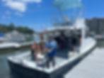 People on an offshore fishing boat at marina