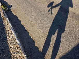 Shadow man with recording equipment