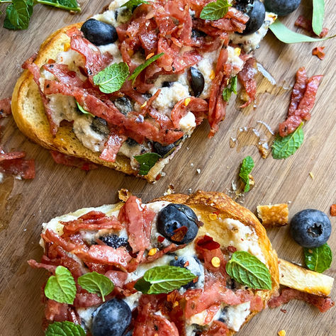 BLUEBERRY RICOTTA TOAST WITH CINNAMON-CRISPED SALAMI, HONEY & MINT