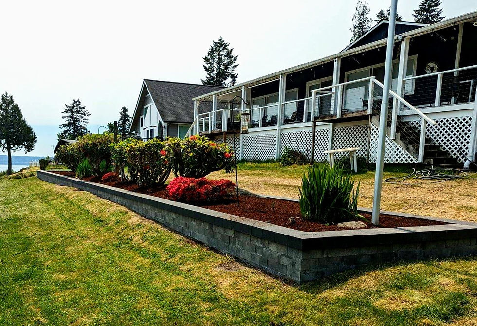 Landscaped flower bed, and green lawn