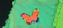 closeup of small ragged orange butterfly in Jessika's quilt