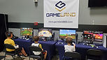 Four PS5 stations under a GameLand banner