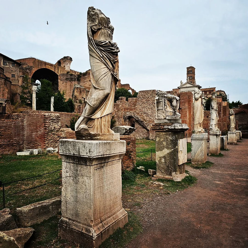 Row of headless Roman statues on Palatine Hill, photographed by mandyleebooks. By colosseum audio guide review 2025.