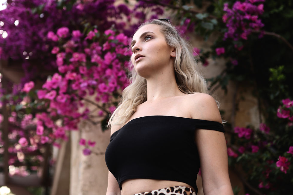 blonde female model with Gucci top with flowers