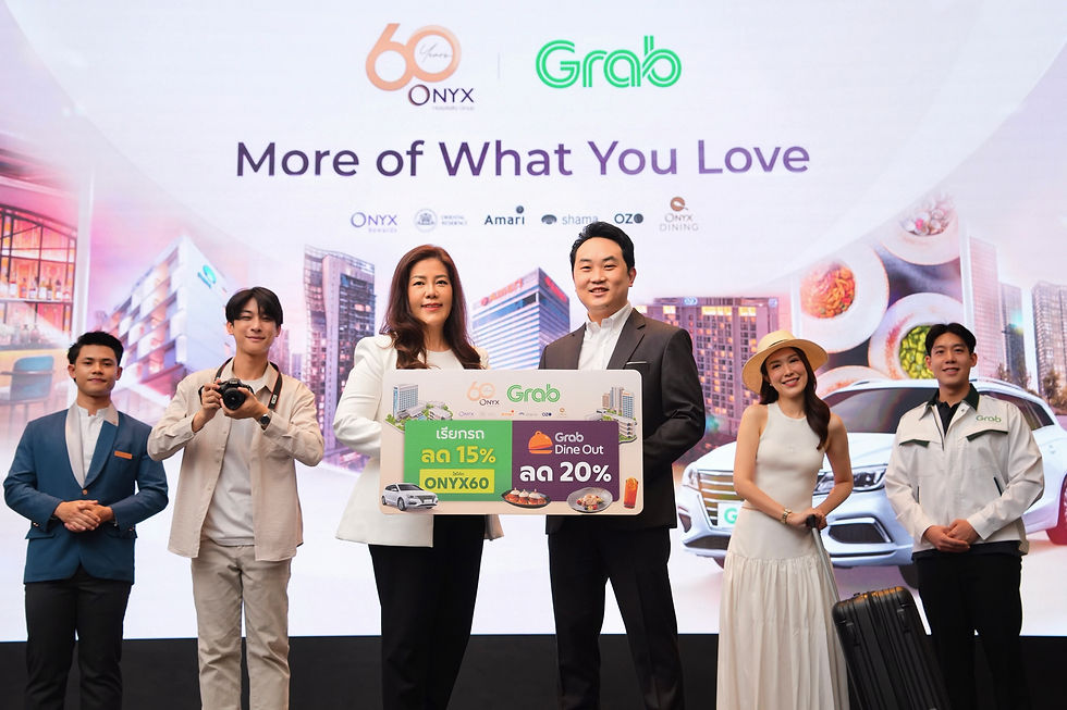 Six people pose at a Grab and ONYX promo event, holding a sign for 15% and 20% discounts under More of What You Love.