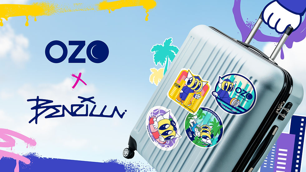 Silver suitcase with OZO stickers under a blue sky, held by a cartoon hand, with colorful paint splashes and playful branding.