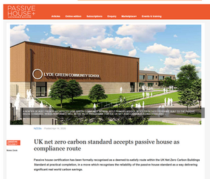 news item about Passive house compliance with UKNZCBC, including a picture of a passivhaus school.