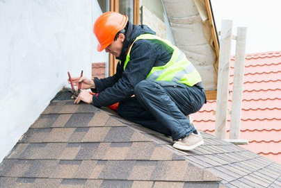 Roofer repairing roof