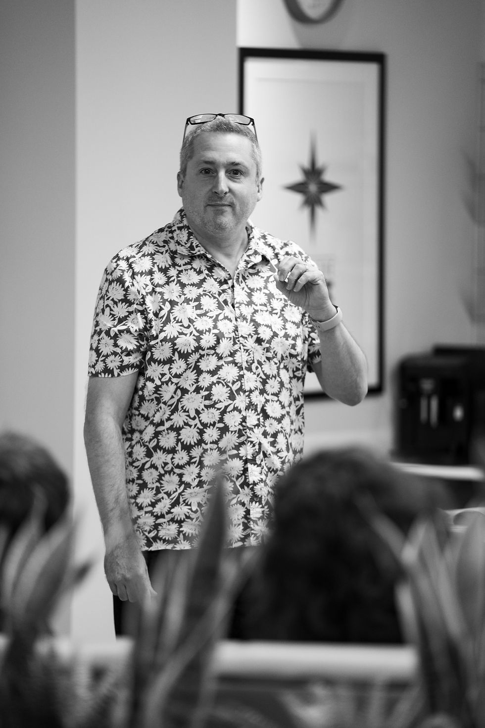 Man speaking in front of colleagues at team meeting