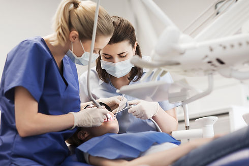 Two women in dental assistant in training
