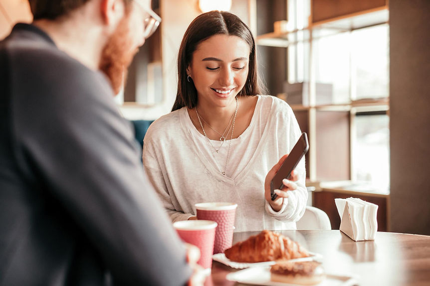 couple-using-smartphone-during-date.jpg