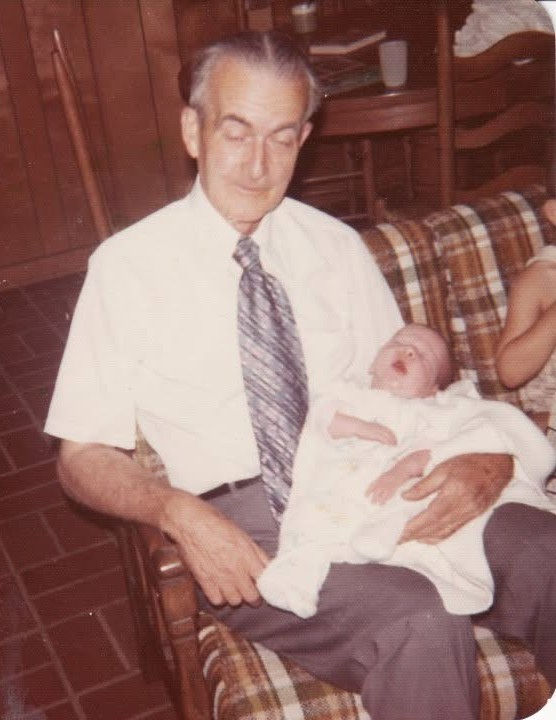Charlie LeCornu holding his grandson Brian Green-Young as a baby