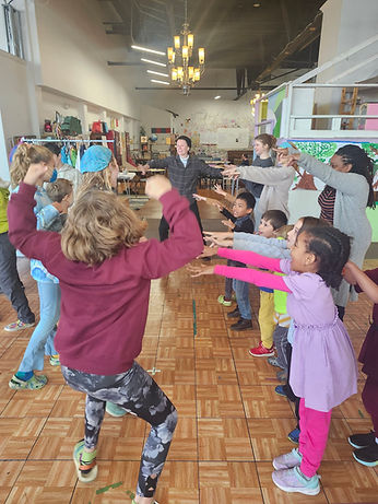 Children playing a group game inside of Natural Creativity in Germantown_