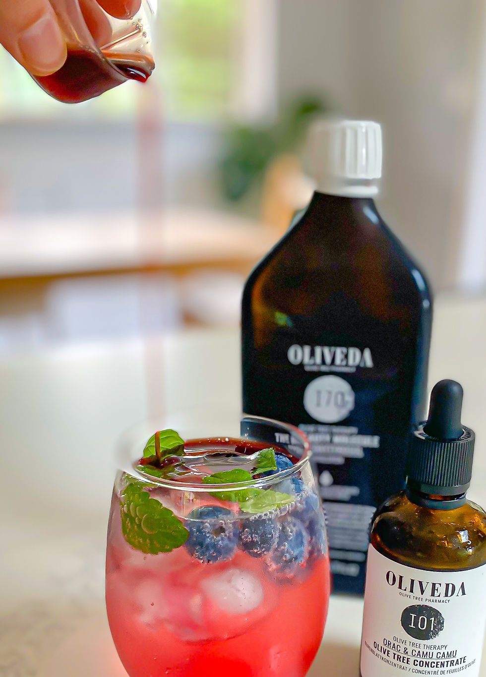 pouring oliveda shot
