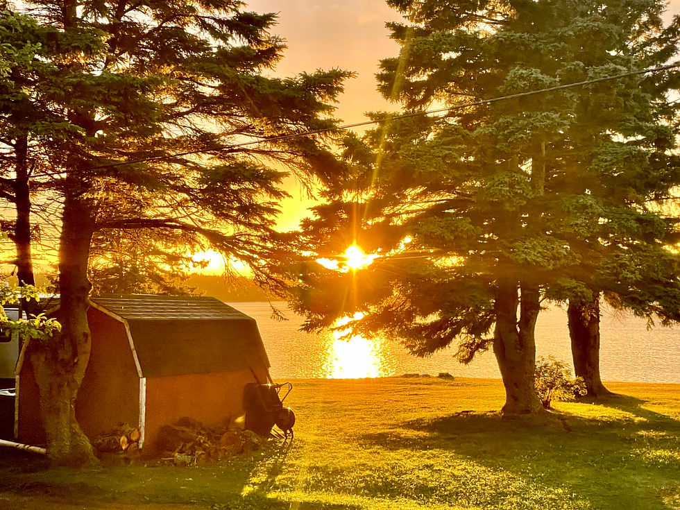 A setting sun "winks" goodbye for the day in Lorneville, Nova Scotia.