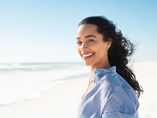 Smiling woman life coach from Siren Soul Coach offering personal transformation