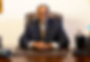 DrBbehindDeskin_Office_edited.jpg