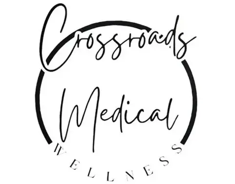 Logo of Crossroads Medical Wellness featuring a stylized design and the name in modern typography.