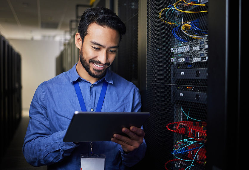man-tablet-and-server-room-programming-or-coding-2023-08-26-08-08-23-utc copy.jpg