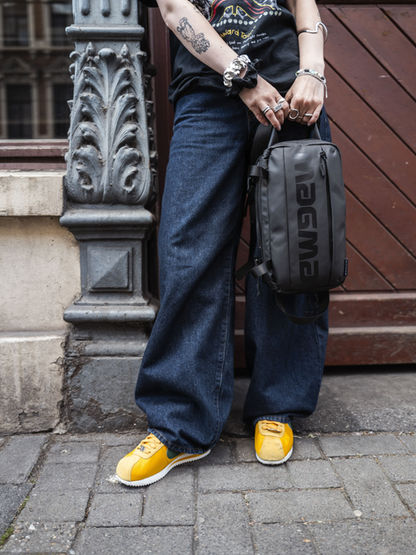 Person holding Solid Blaze X-Bag , stylish streetwear