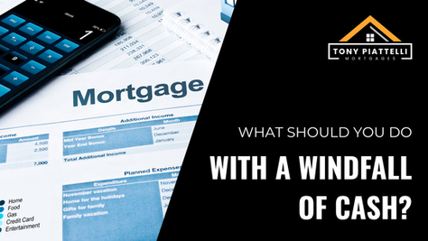 Image of mortgage documents and a calculator with text that says What should you do with a windfall of cash?