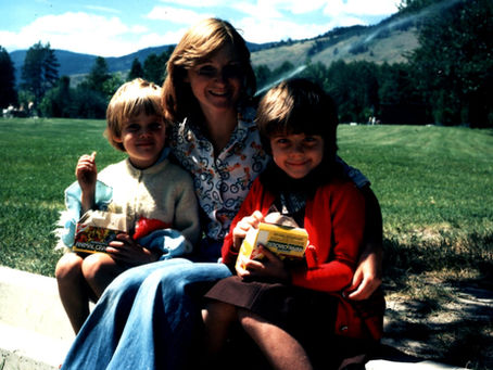 Family photo of sisters sharing animal crackers from auntie.