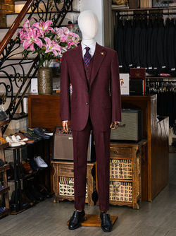a mannequin wearing a 3-piece flannel burgundy Suit by Carlo Pham tailor in Hanoi, Vietnam 