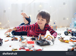 stock-photo-little-child-playing-with-lots-of-colorful-plastic-toys-indoor-building-differ