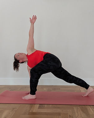 Yoga student performing a revolved lunge.