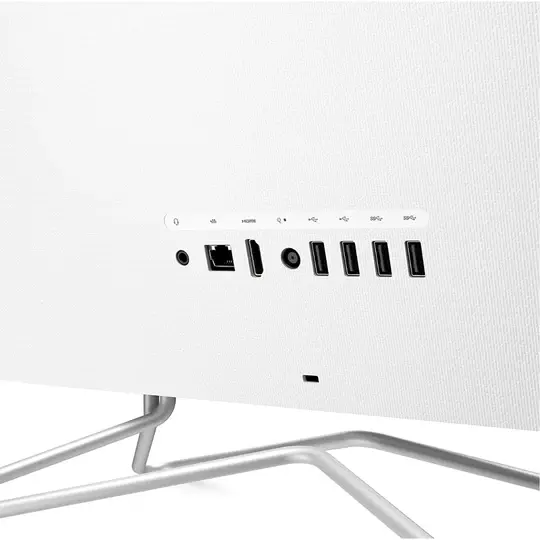 Arrière d'un ordinateur blanc avec des ports et des connexions visibles.