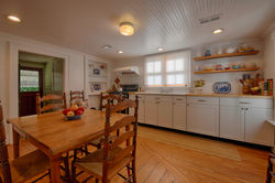 Full Equipped Kitchen with Wooden Dining Table