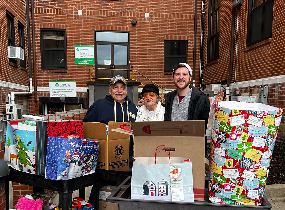 Jordan unloading Christmas gifts for children outside of West Penn Hospital.