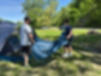 Exchange student and mentor pitching a tent during Overland Youth camping trip — youth leadership, outdoor adventure nonprofit.