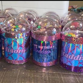 Custom snow globe tumblers with glitter and personalized names by Made By Que