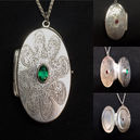 Etched paisley locket with emerald and ruby