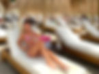 Women enjoying La Sala By The Sea beach beds during hen weekend