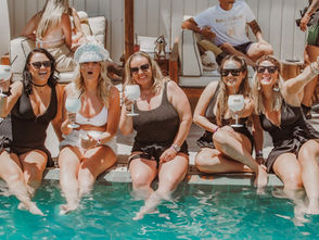 Hen party women VIP sunbeds cocktails luxury beach club Marbella
