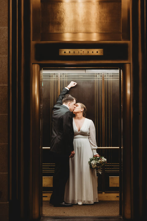 Wedding bride groom elevator flowers