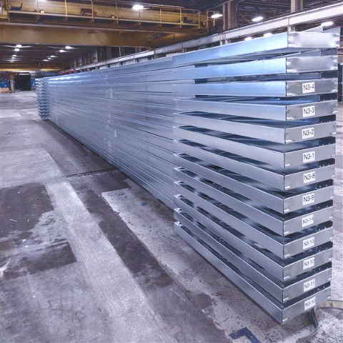 Close-up view of light gauge steel cold-formed rolled trusses stacked neatly, showcasing their sturdy construction and readiness for shipping.